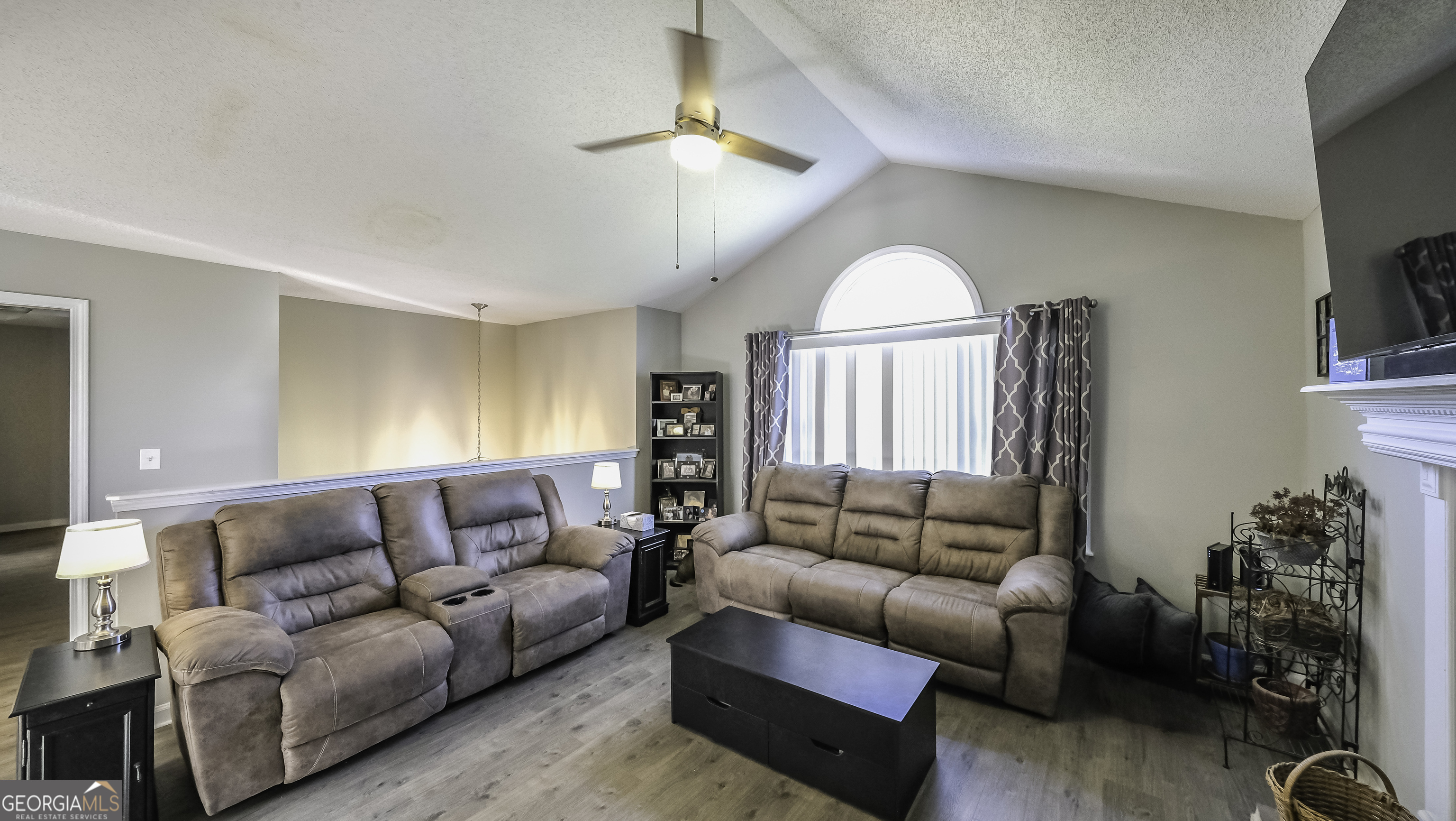 85 Taylors Gin Road Temple, GA 30179 - Photo 12 of 45 a living room with furniture a chandelier and a window