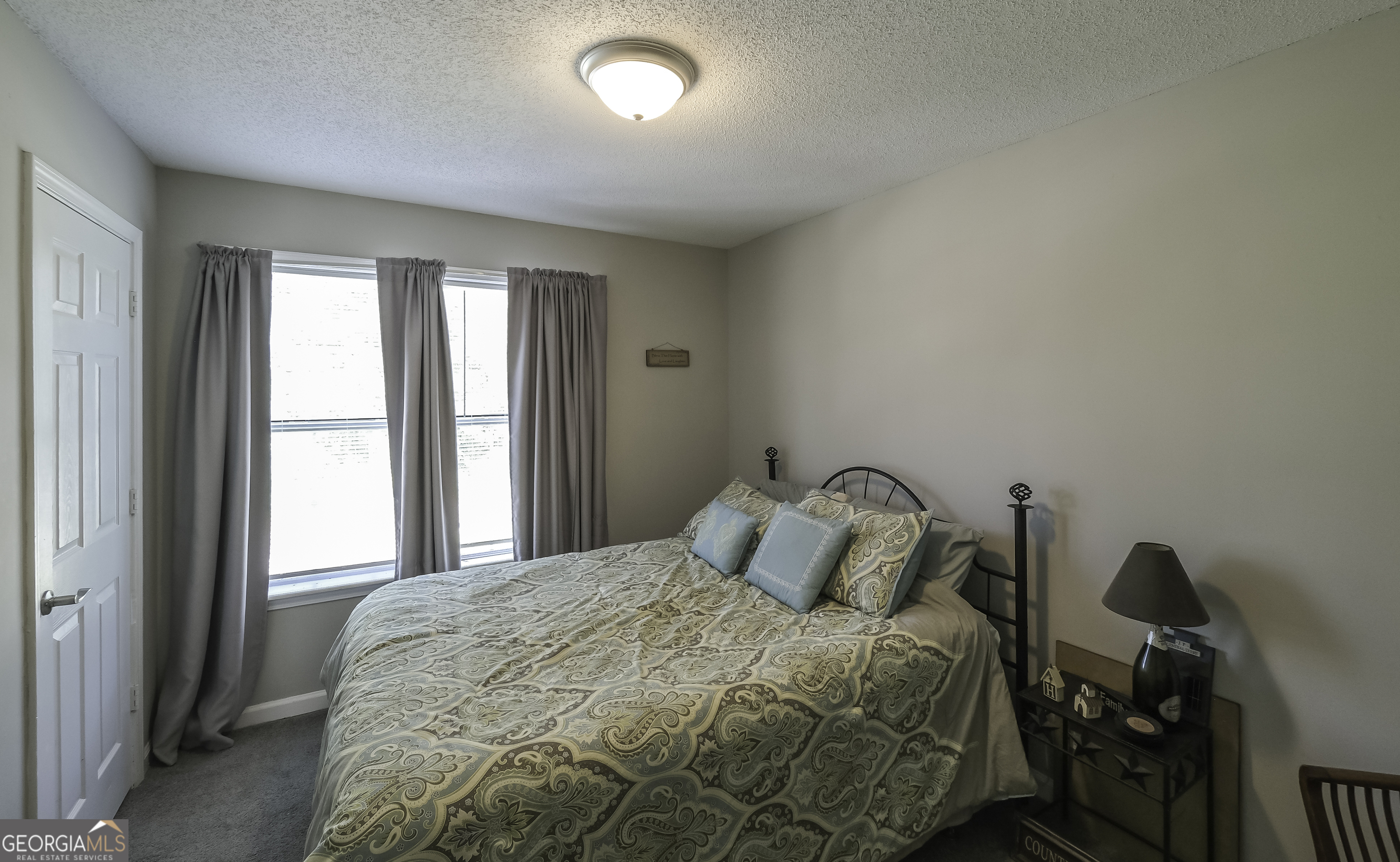85 Taylors Gin Road Temple, GA 30179 - Photo 20 of 45 a bedroom with a bed and window