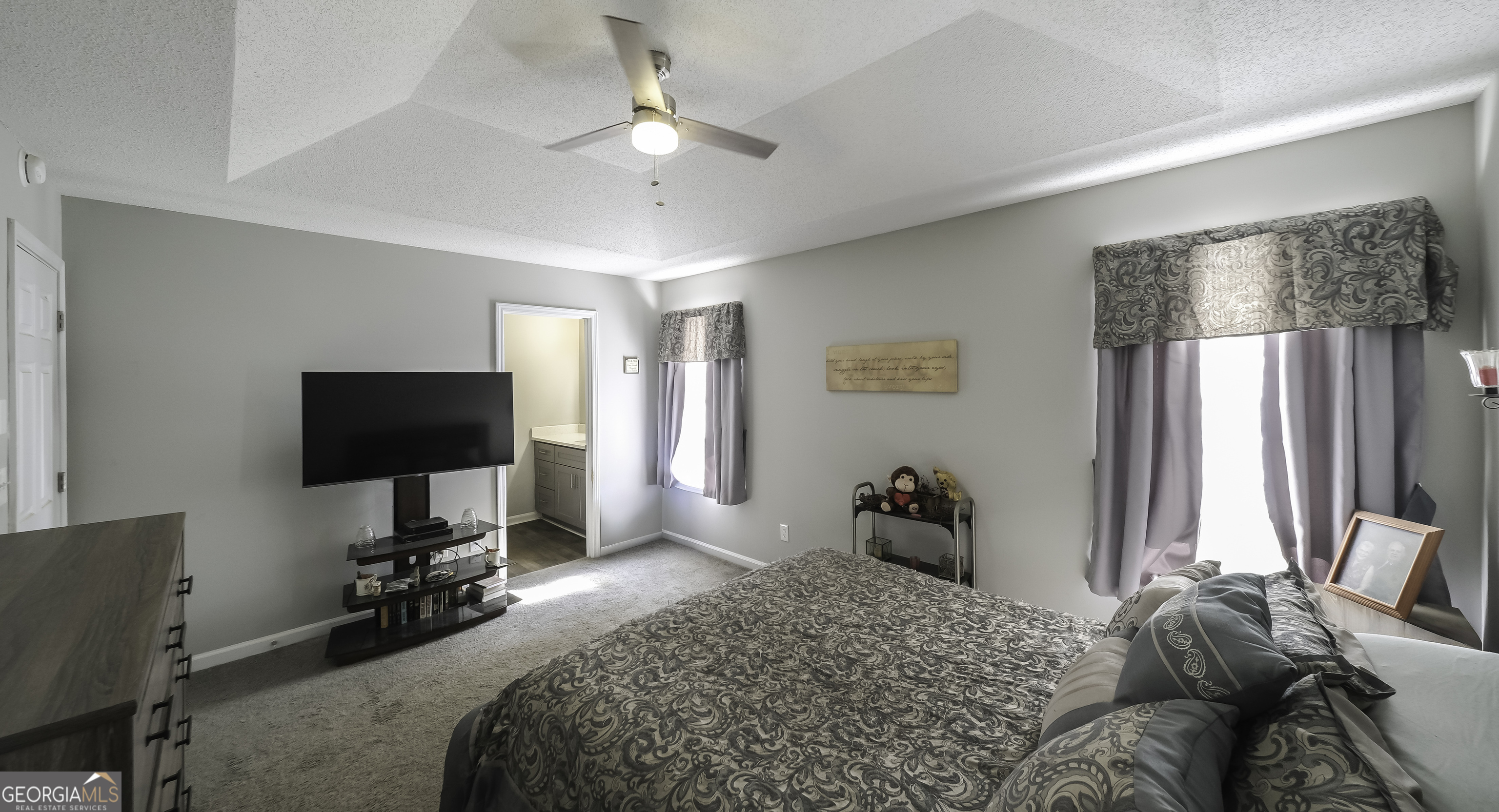 85 Taylors Gin Road Temple, GA 30179 - Photo 2 of 45 a bedroom with a bed and a television