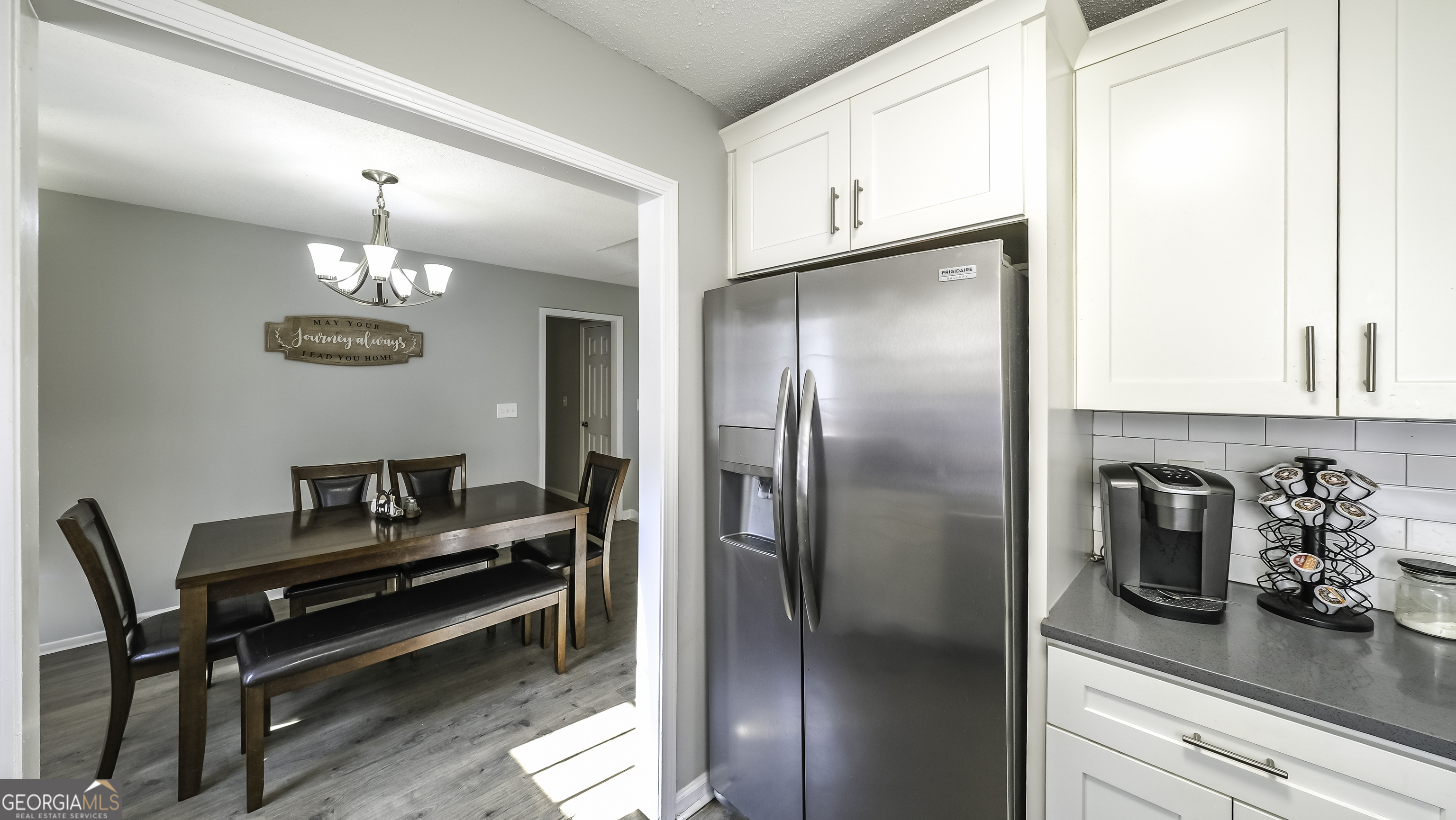 85 Taylors Gin Road Temple, GA 30179 - Photo 21 of 45 a kitchen with a refrigerator and a coffee maker on it