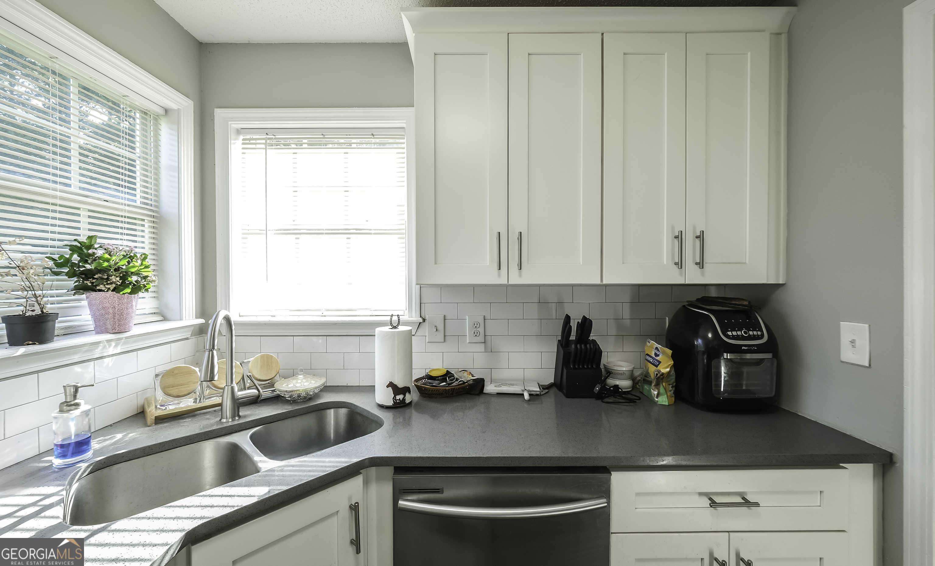 85 Taylors Gin Road Temple, GA 30179 - Photo 22 of 45 a kitchen with a sink and cabinets
