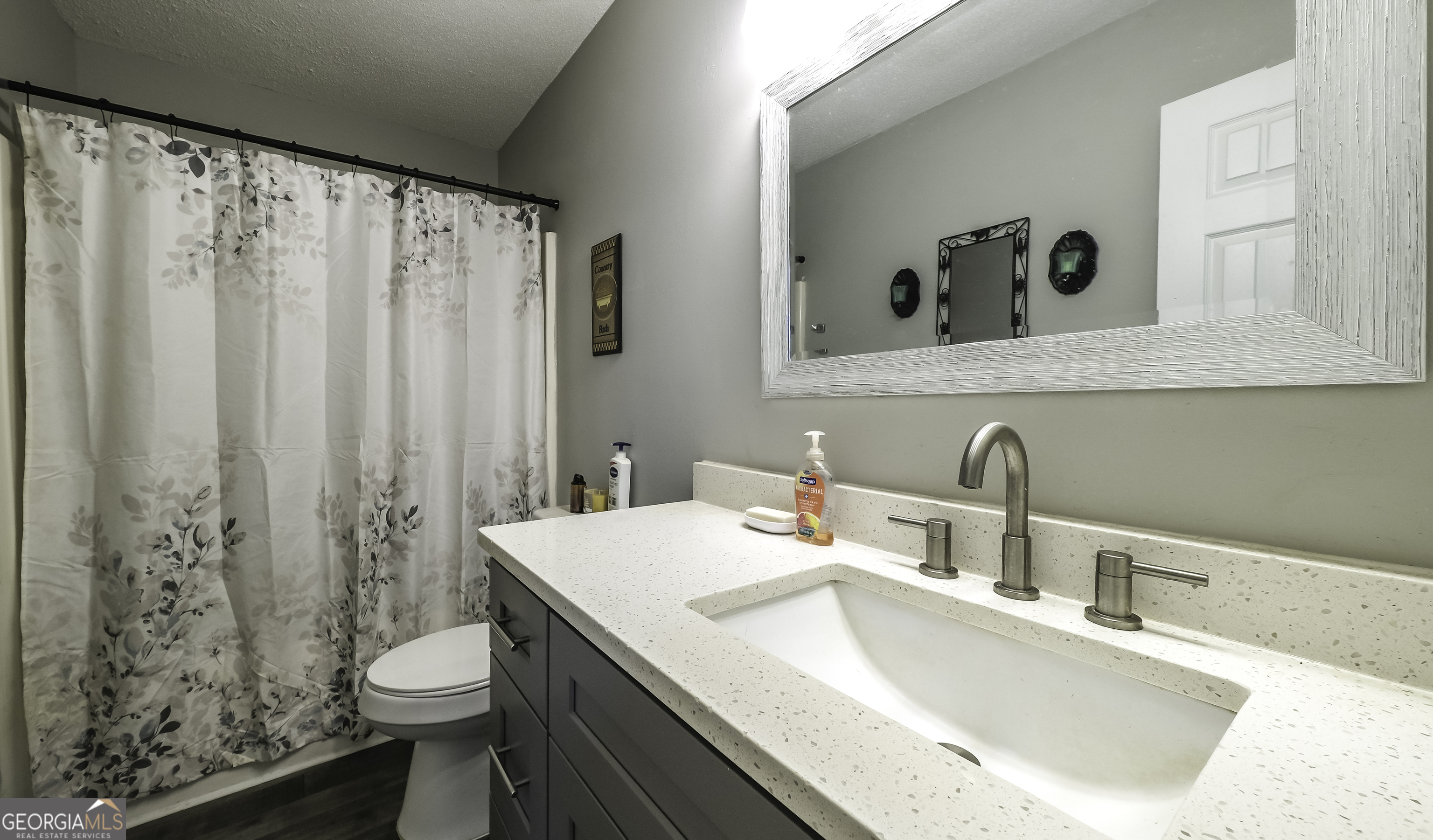 85 Taylors Gin Road Temple, GA 30179 - Photo 26 of 45 a bathroom with a sink toilet and shower