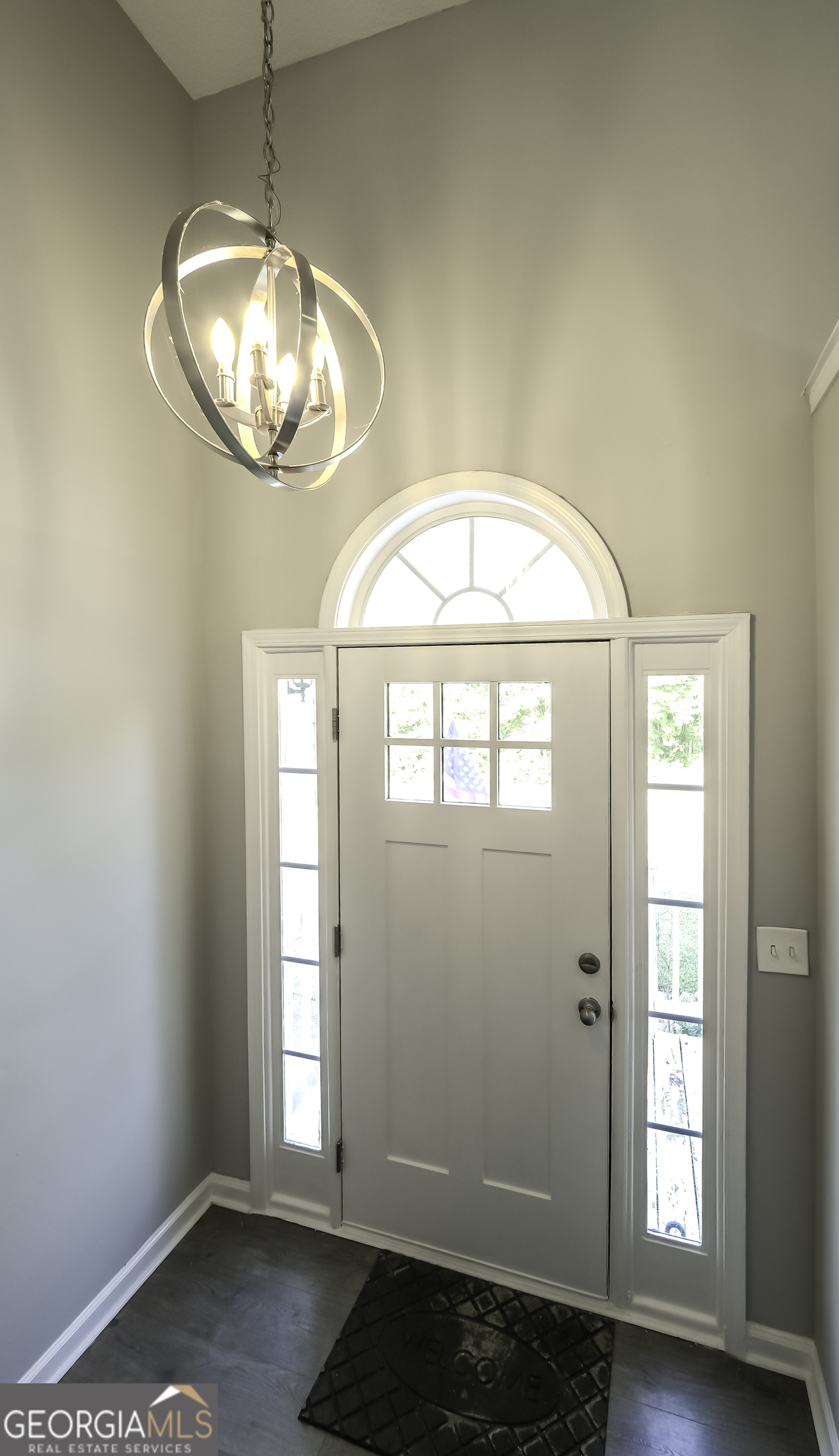 85 Taylors Gin Road Temple, GA 30179 - Photo 30 of 45 an empty room with chandelier fan and windows