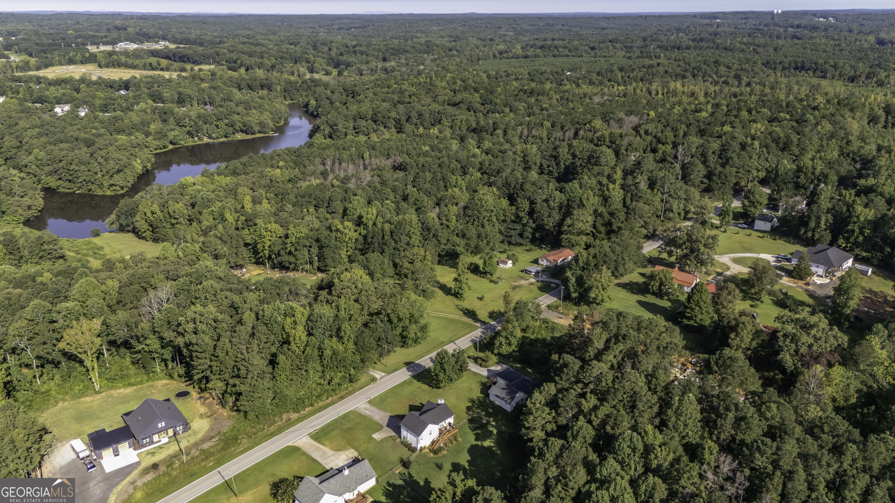 85 Taylors Gin Road Temple, GA 30179 - Photo 38 of 45 an aerial view of residential houses with outdoor space and trees