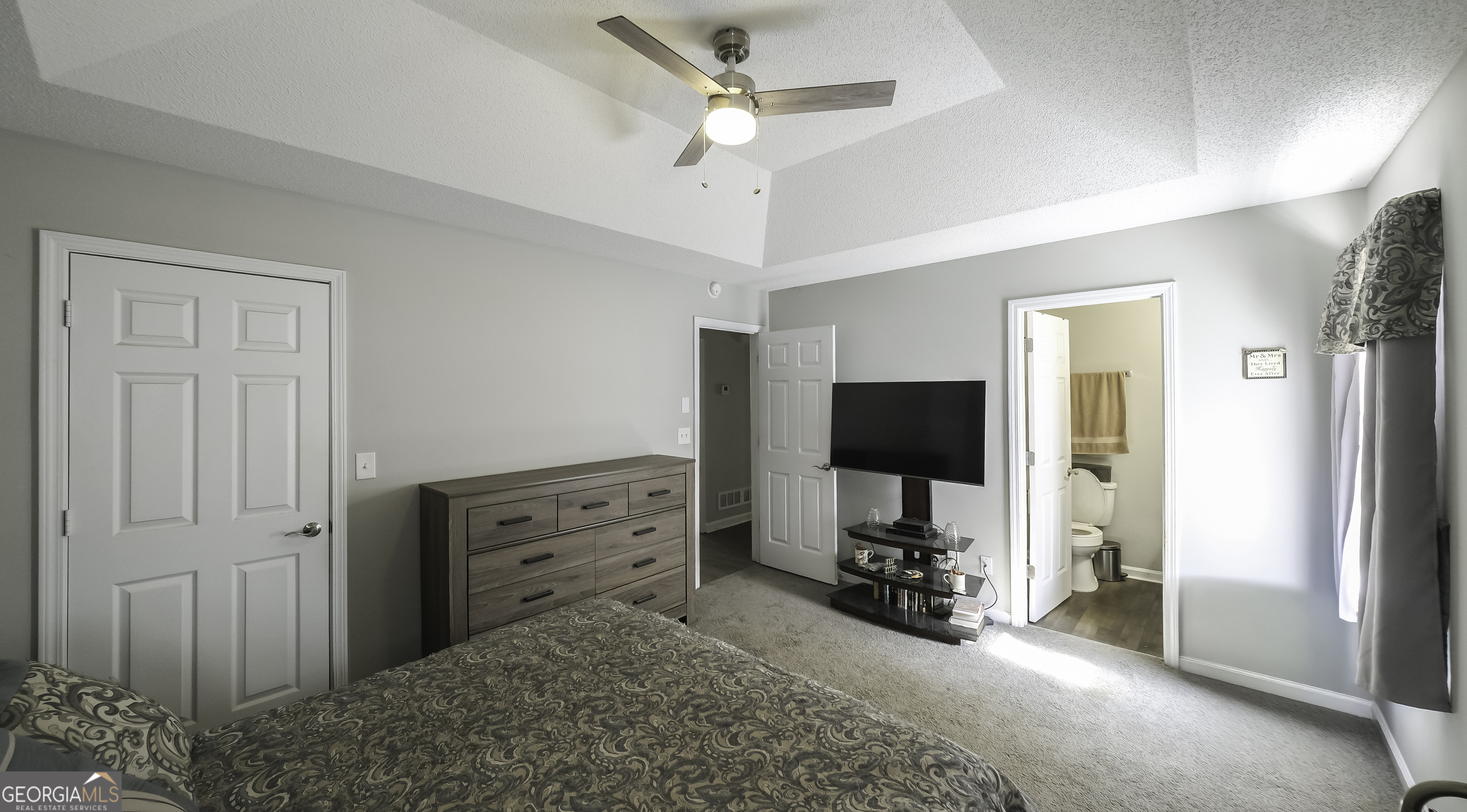 85 Taylors Gin Road Temple, GA 30179 - Photo 4 of 45 a view of a bedroom with cabinet flat screen tv and windows