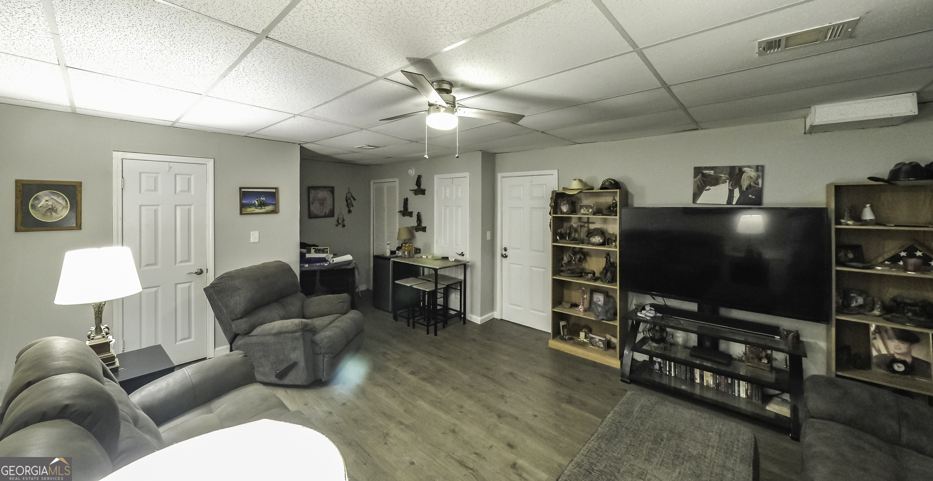 85 Taylors Gin Road Temple, GA 30179 - Photo 6 of 45 a living room with furniture and a flat screen tv