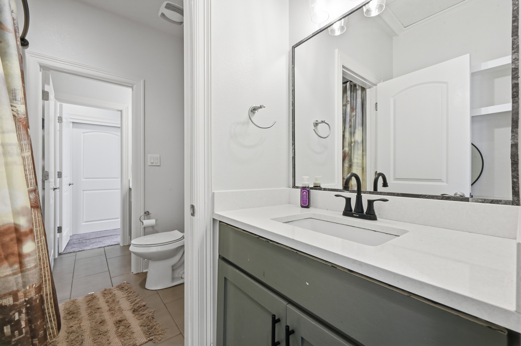 592 Farm To Market 967, Unit B Buda, TX 78610 - Photo 23 of 26 Clean lines and contemporary finishes give this spacious bath a bright, timeless feel, creating a comfortable space to start and end each day.