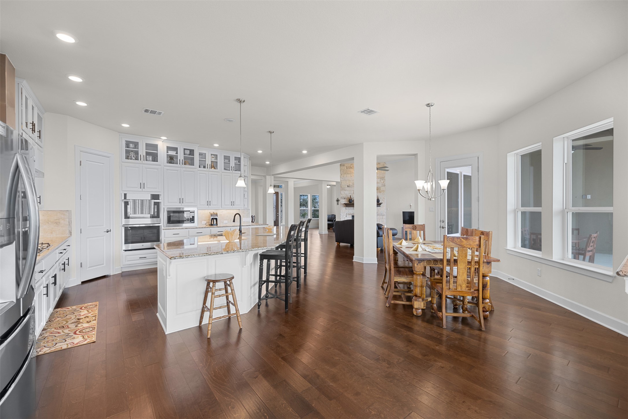 235 Chestnut Crossing Burnet, TX 78611 - Photo 13 of 39 a dining room with furniture and wooden floor