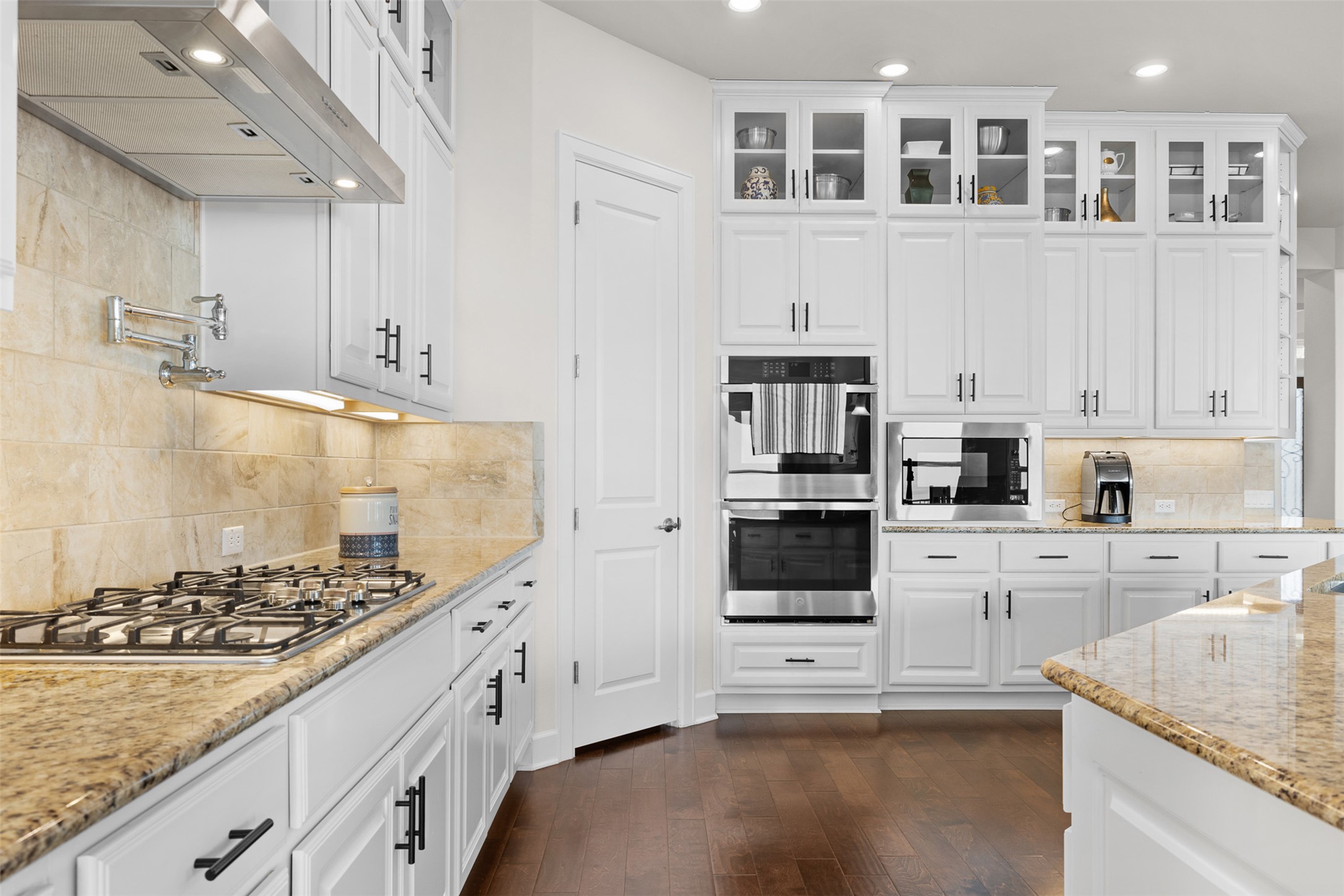 235 Chestnut Crossing Burnet, TX 78611 - Photo 16 of 39 a kitchen with stainless steel appliances granite countertop a stove and a sink