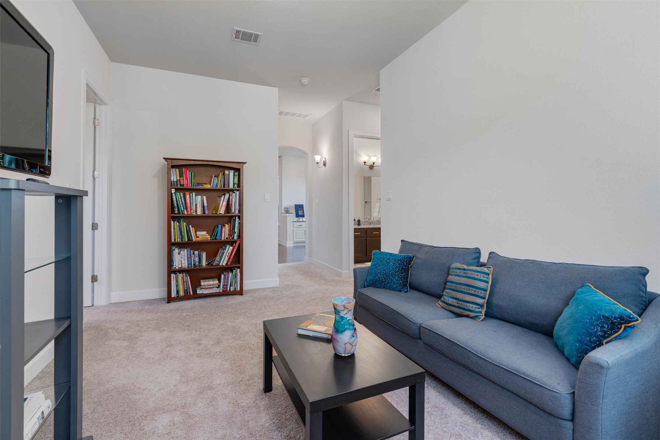 235 Chestnut Crossing Burnet, TX 78611 - Photo 26 of 39 a living room with furniture and a flat screen tv