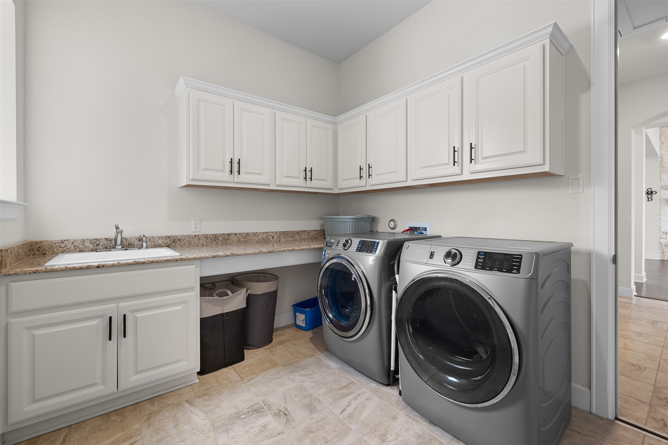 235 Chestnut Crossing Burnet, TX 78611 - Photo 28 of 39 a utility room with sink dryer and washer