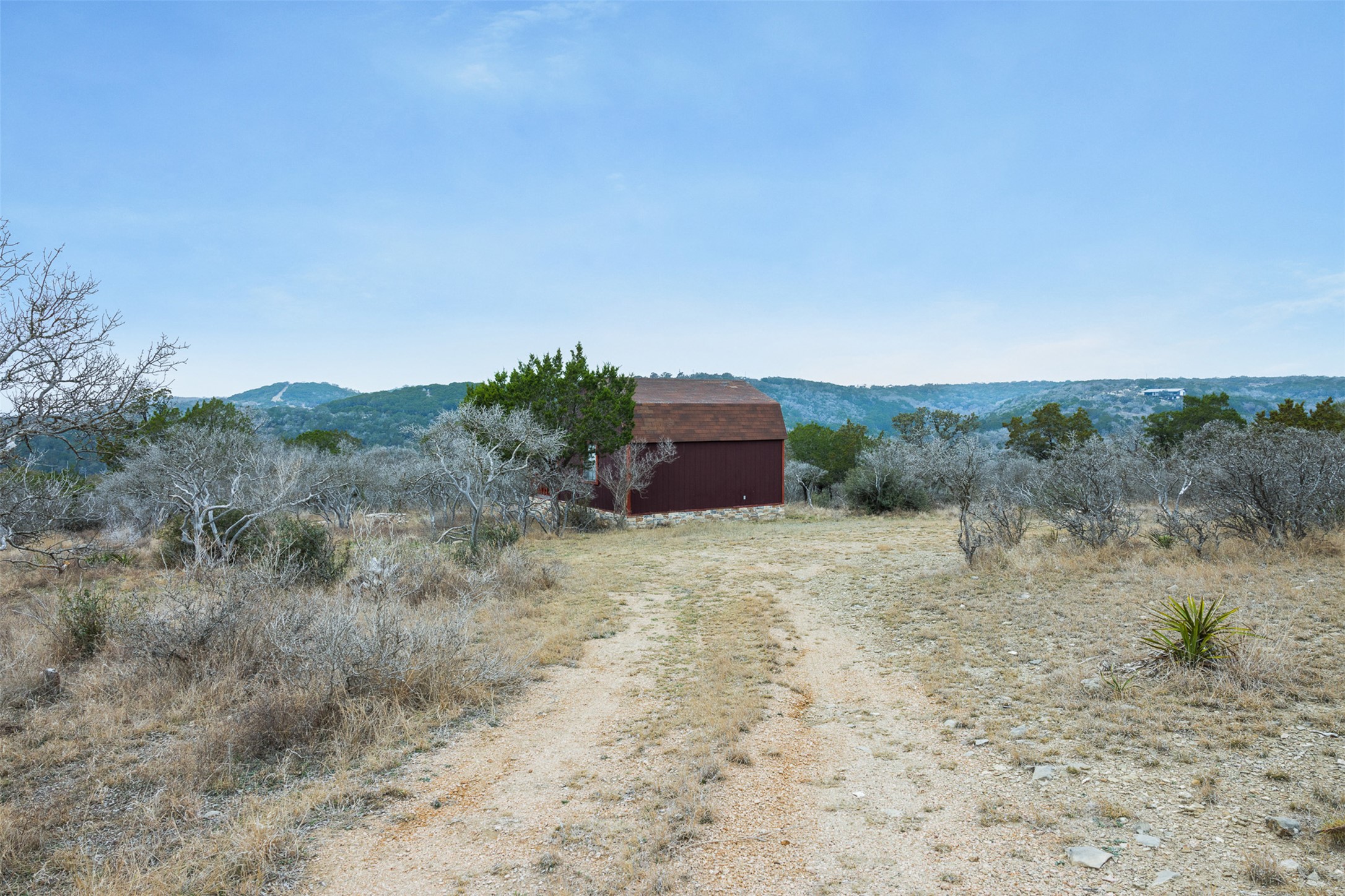 235 Chestnut Crossing Burnet, TX 78611 - Photo 35 of 39 a big yard with lots of bushes