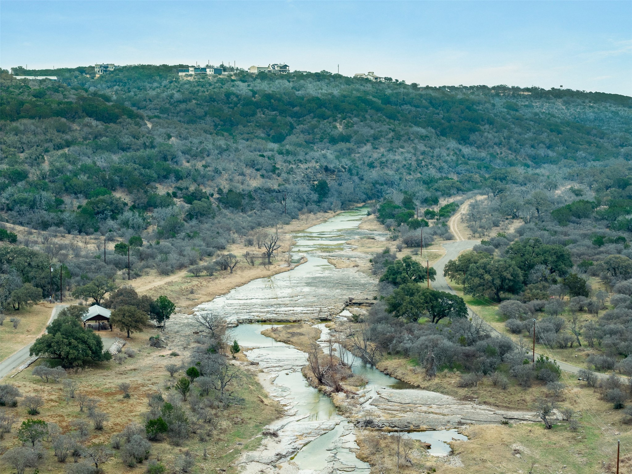 235 Chestnut Crossing Burnet, TX 78611 - Photo 39 of 39 View of mountain backdrop featuring a large body of water and a forest