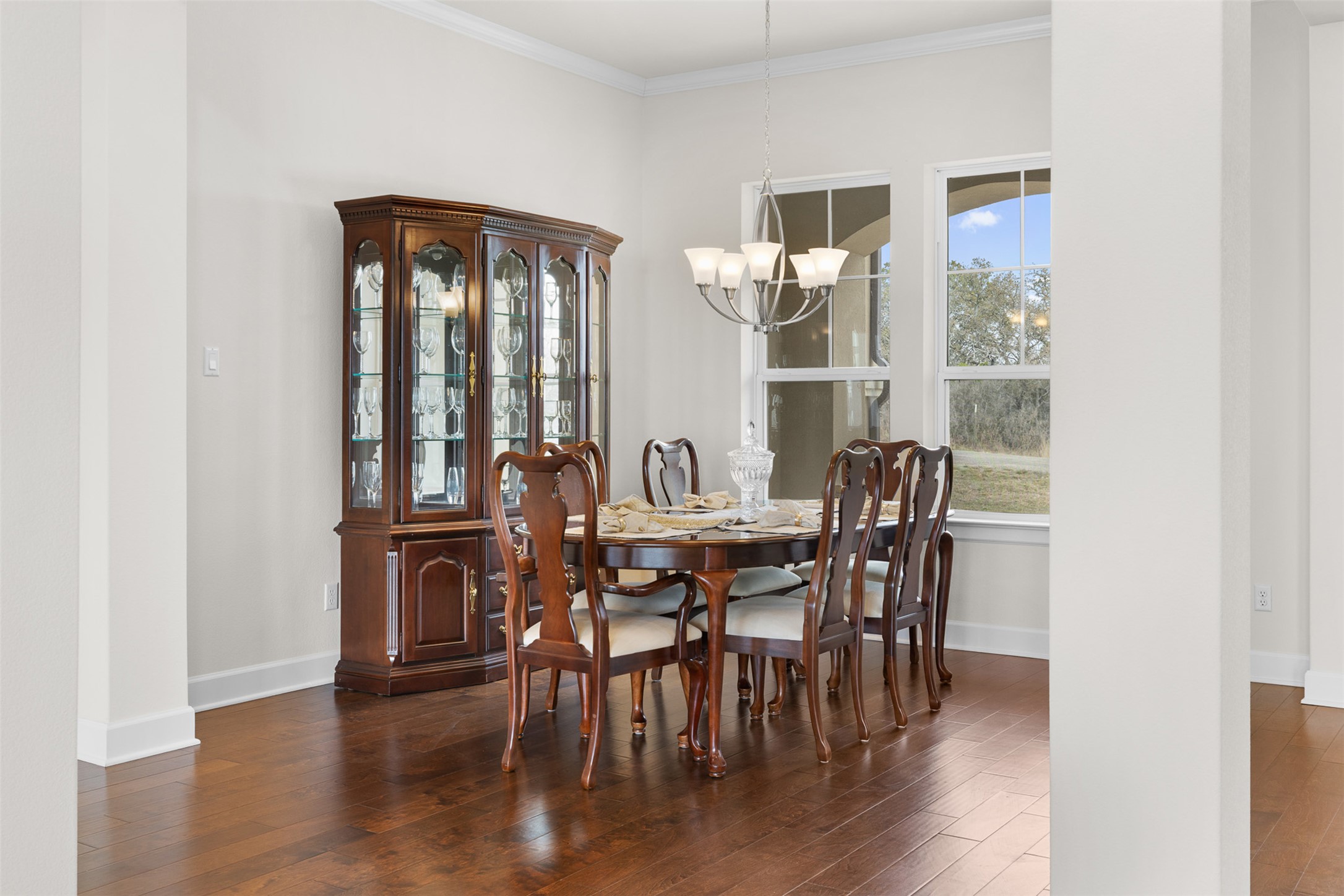 235 Chestnut Crossing Burnet, TX 78611 - Photo 8 of 39 a view of a dining room with furniture and wooden floor
