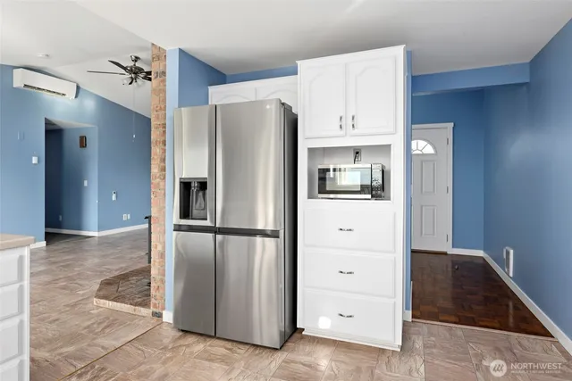 a kitchen with a refrigerator and countertop