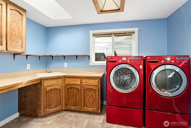 a kitchen with a stove top oven sink and cabinets