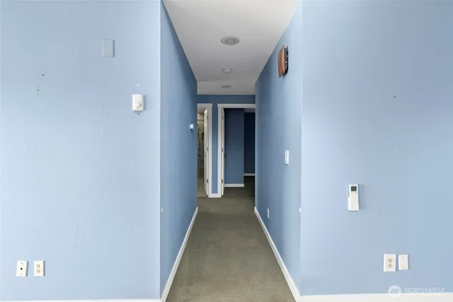 a view of a hallway with a white walls