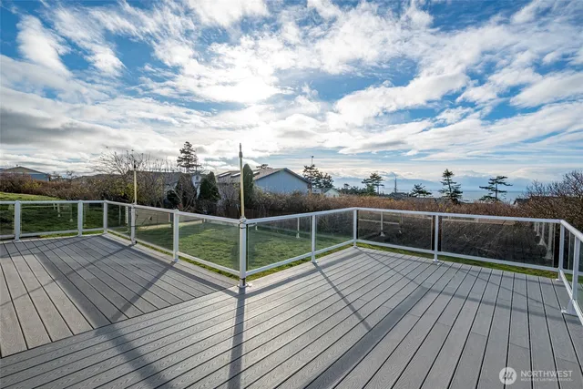 a view of deck with wooden floor and fence