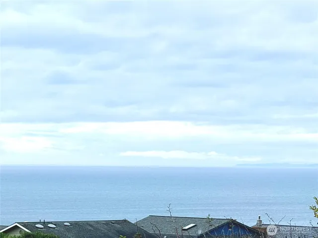 a view of a roof deck with wooden floor and fence