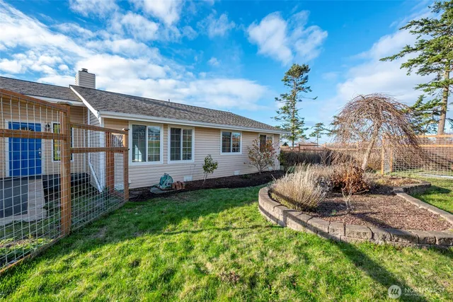 an aerial view of a house with a garden