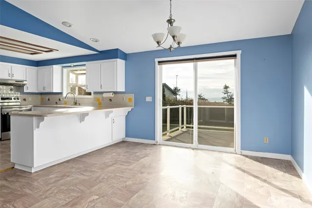 a view of a kitchen with a sink cabinets and a window