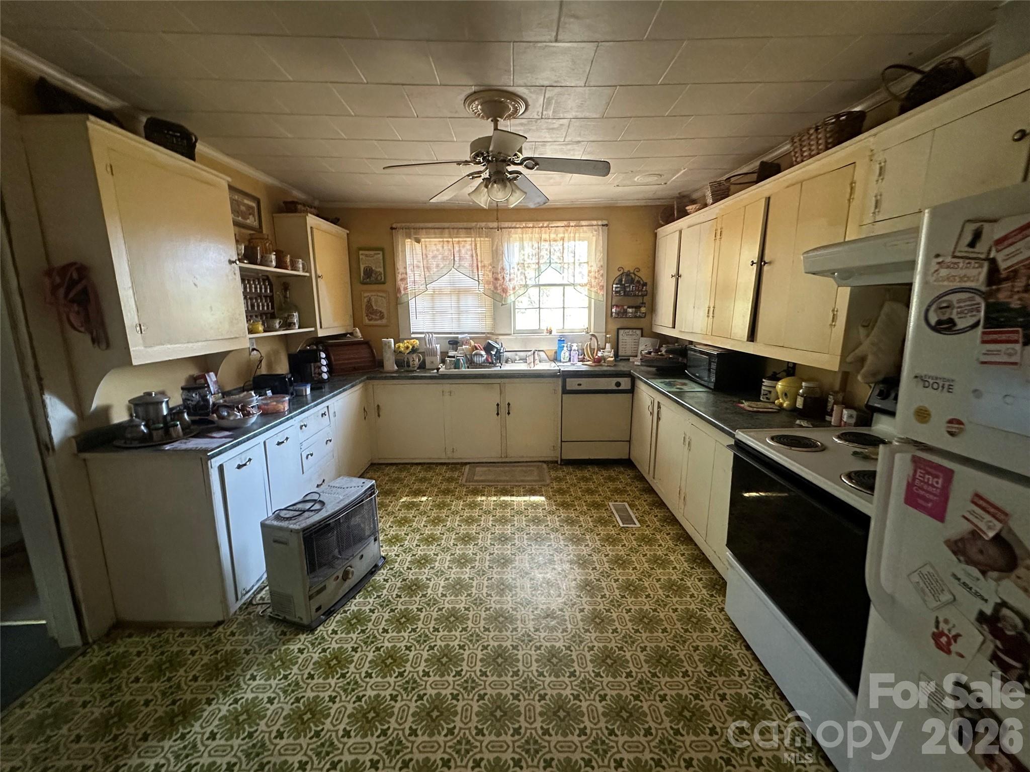 241 Wilson Road Rutherfordton, NC 28139 - Photo 4 of 14 a kitchen with sink cabinets and window