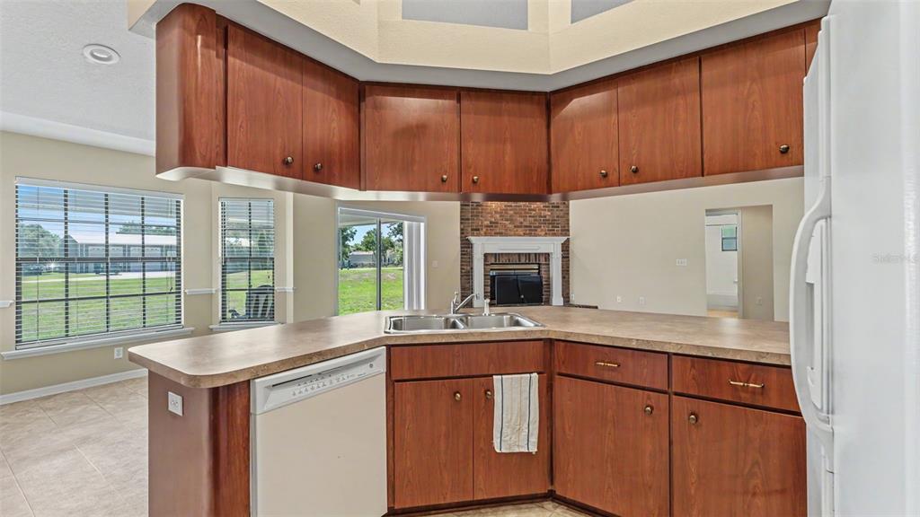 8525 North Campbell Road Lakeland, FL 33810 - Photo 28 of 45 a kitchen with kitchen island granite countertop a sink and a large window