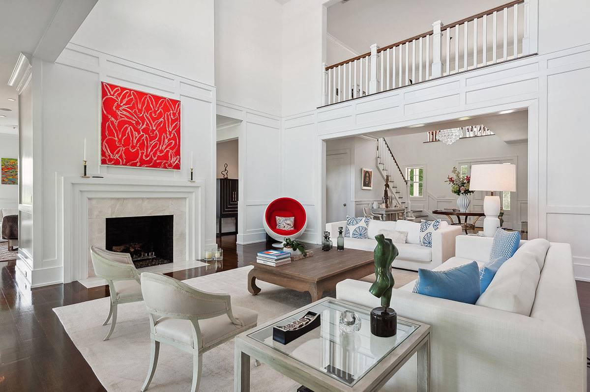 63 Newlight Lane Bridgehampton, NY 11976 - Photo 5 of 37 a living room with furniture a fireplace and kitchen view