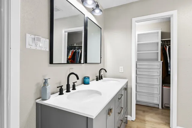 a bathroom with a sink and a mirror