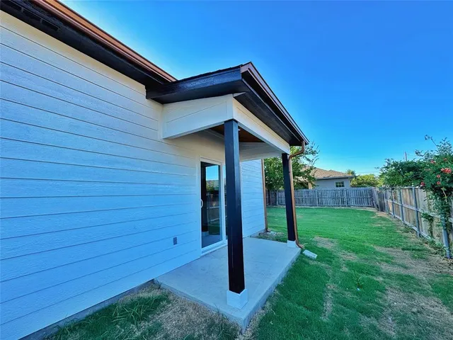 a backyard of a house with lots of green space