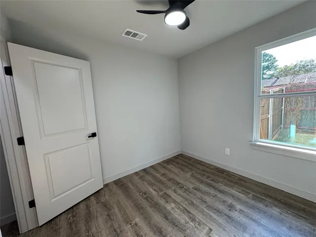 a view of an empty room and window