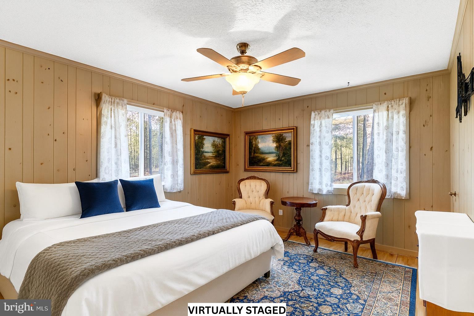 310 Brush Neck Road Susan, VA 23163 - Photo 18 of 66 a bedroom with a bed and a chandelier