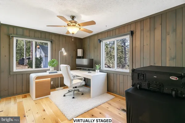 a view of a porch with wooden floor and stairs