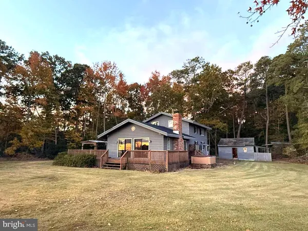 a view of swimming pool and lake from inside of house