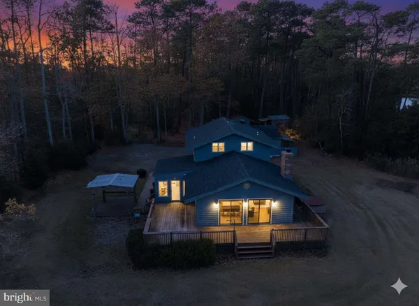 an aerial view of a houses with ocean view