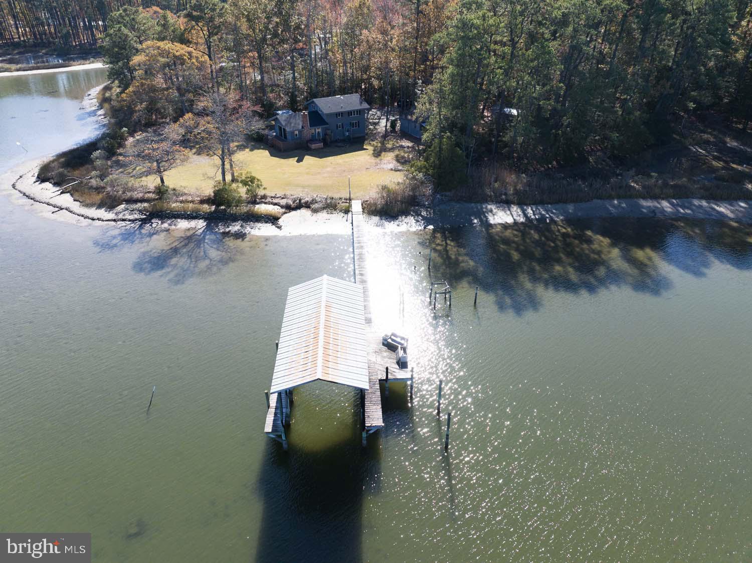 310 Brush Neck Road Susan, VA 23163 - Photo 45 of 66 a view of swimming pool and lake from inside of house