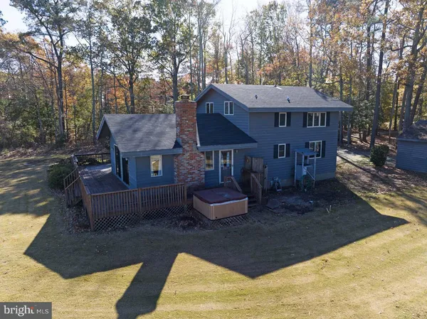 a view of a dining room with furniture and a window