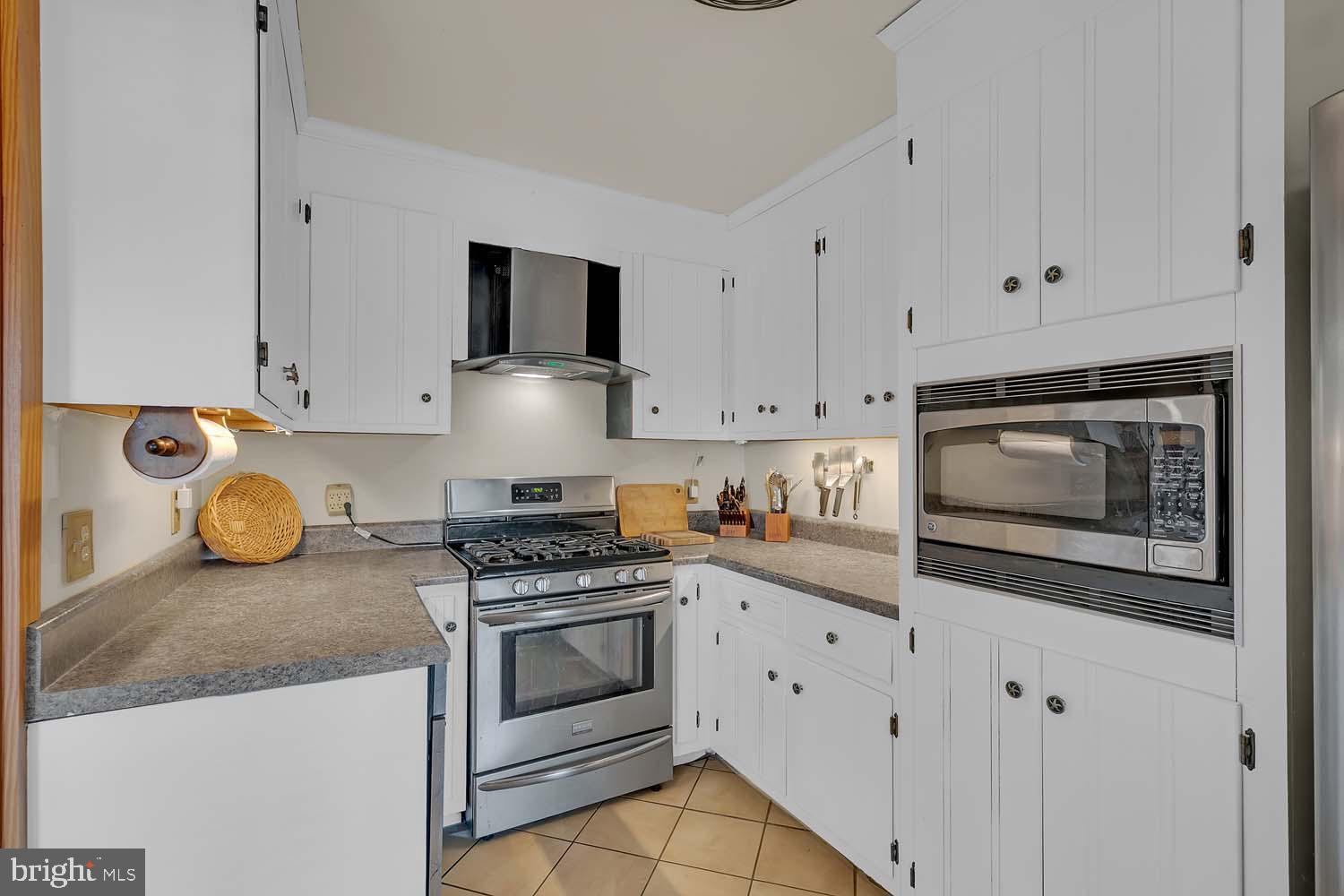 310 Brush Neck Road Susan, VA 23163 - Photo 9 of 66 a kitchen with stainless steel appliances granite countertop a stove a microwave and cabinets