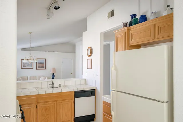 a bathroom with a sink a mirror and a shower