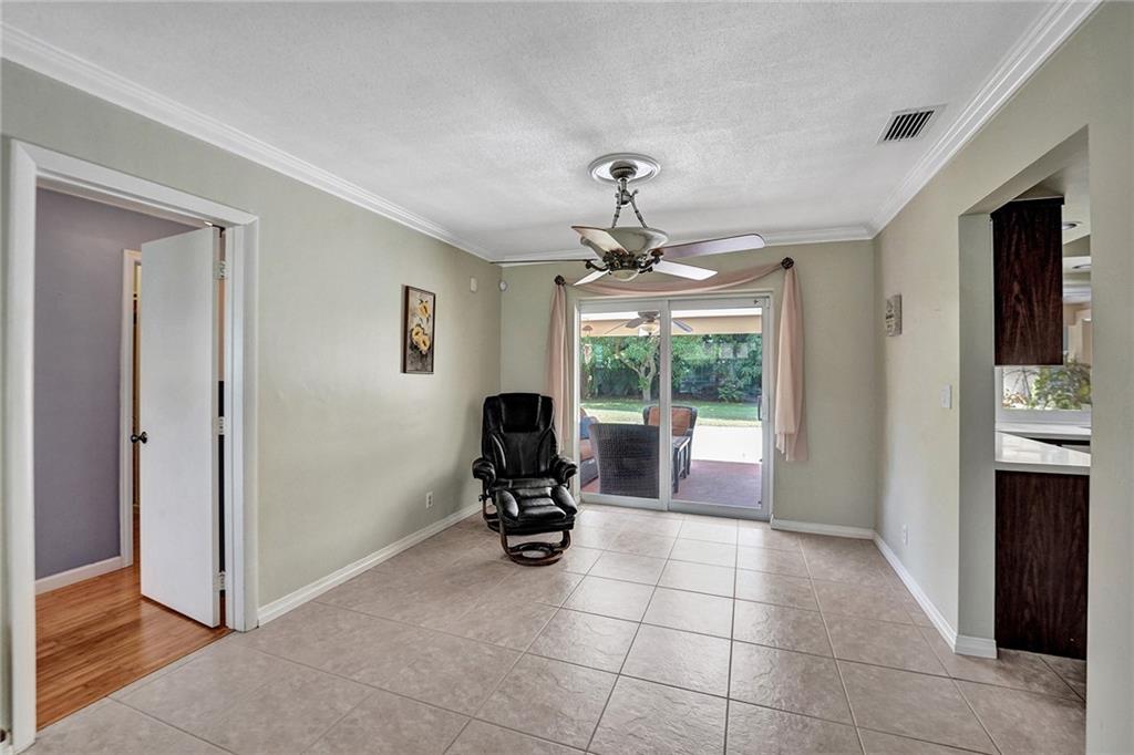 5760 Southwest 7th Street Plantation, FL 33317 - Photo 19 of 56 a view of a livingroom with furniture and floor to ceiling window