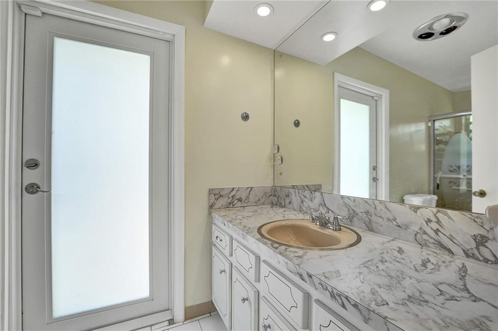 5760 Southwest 7th Street Plantation, FL 33317 - Photo 26 of 56 a bathroom with a sink double vanity and a mirror