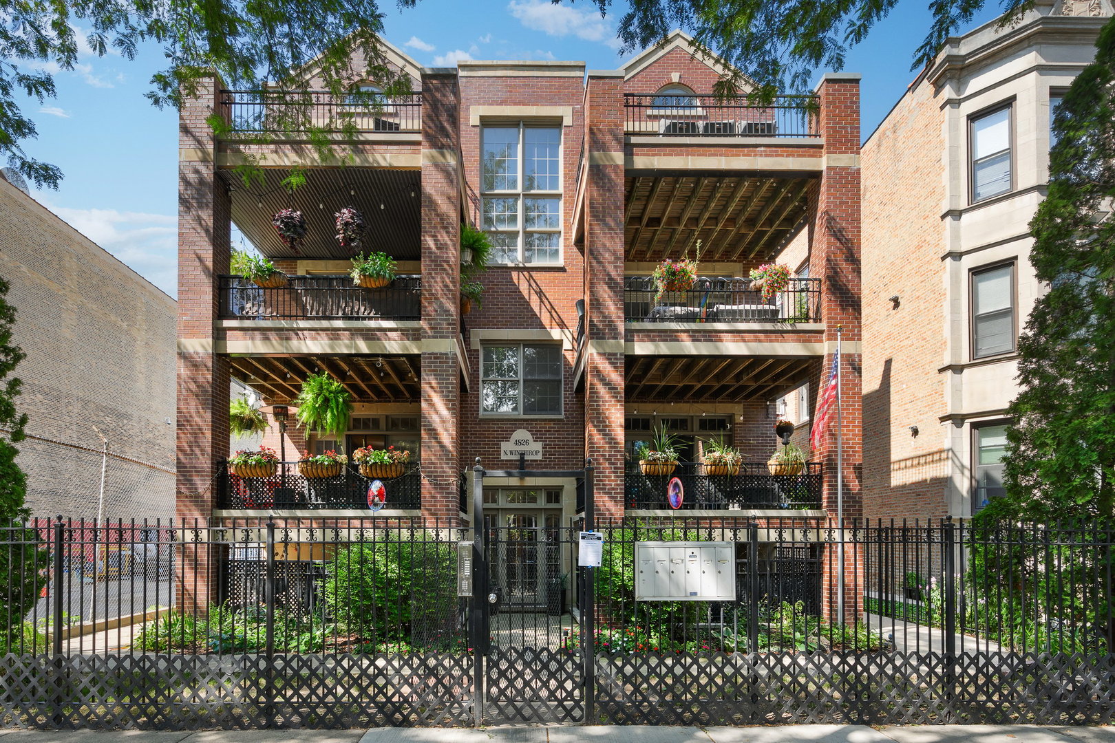 4826 North Winthrop Avenue, Unit 2S Chicago, IL 60640 - Photo 1 of 21 a front view of a house with a garden