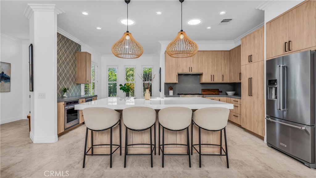 76931 Tomahawk Run Indian Wells, CA 92210 - Photo 5 of 29 Oversized kitchen island with ample seating for four and more if you use the sides of the island