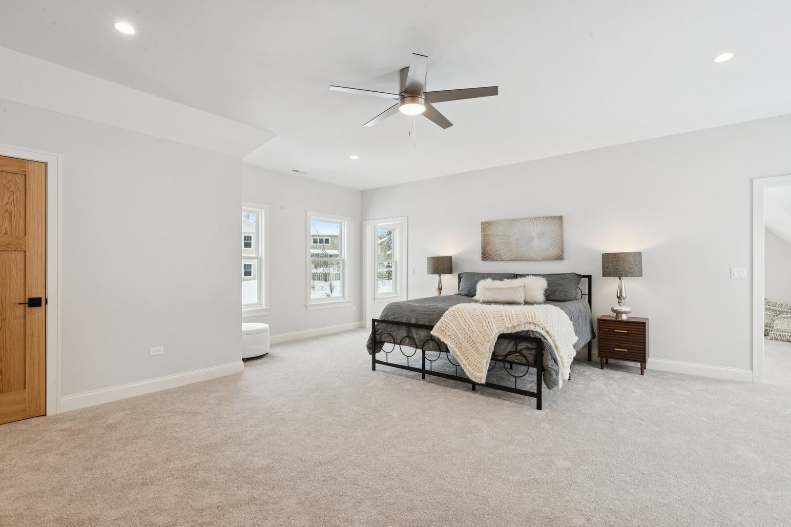 885 Geneva Road St. Charles, IL 60174 - Photo 37 of 62 a spacious bedroom with a bed and a ceiling fan