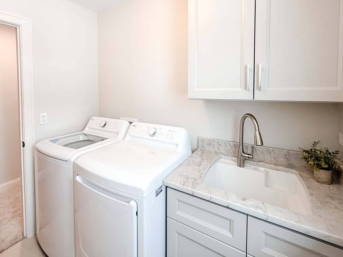 885 Geneva Road St. Charles, IL 60174 - Photo 45 of 62 a utility room with sink dryer and washer