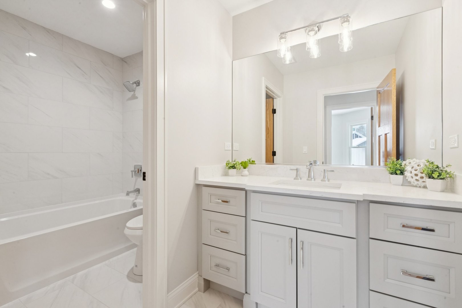 885 Geneva Road St. Charles, IL 60174 - Photo 51 of 62 a bathroom with a shower sink vanity and mirror