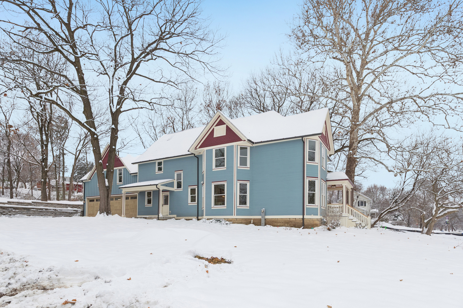 885 Geneva Road St. Charles, IL 60174 - Photo 58 of 62 a front view of a house with a yard covered in snow