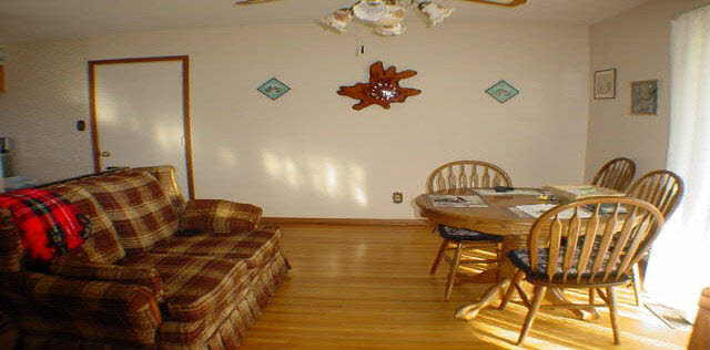 6645 Simpson Road Rockford, IL 61102 - Photo 4 of 6 a view of a dining room with furniture and chandelier