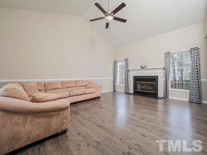 5520 Edgebury Road Raleigh, NC 27613 - Photo 11 of 29 a living room with furniture and a fireplace