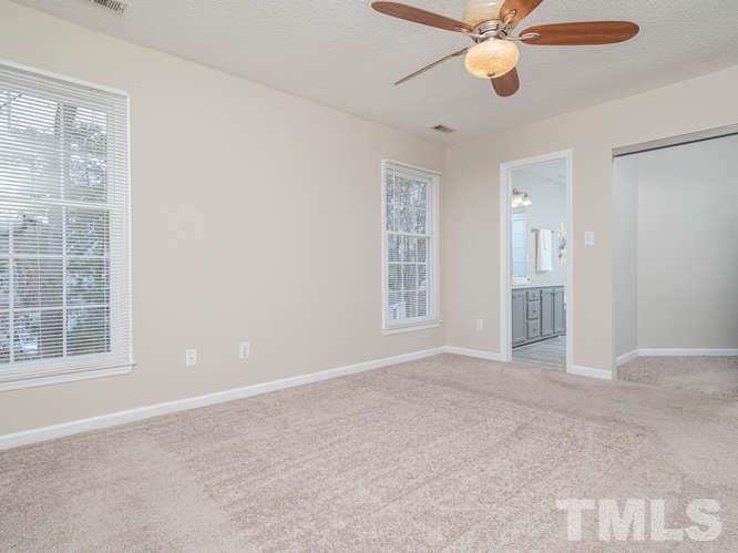 5520 Edgebury Road Raleigh, NC 27613 - Photo 13 of 29 an empty room with windows and fan